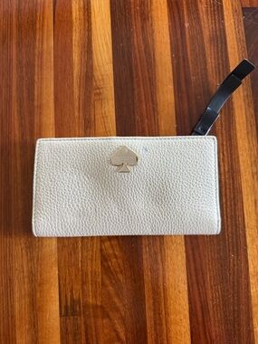 kate spade Ivory Pebbled Leather Wristlet Wallet with Black Strap